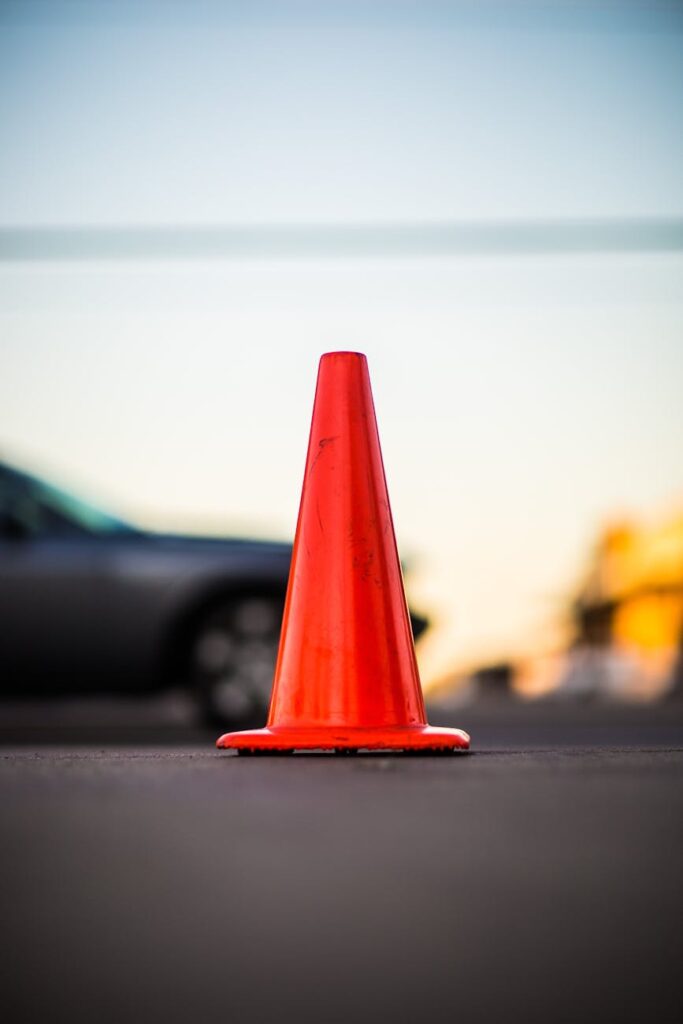 selective focus photography of orange road cone
