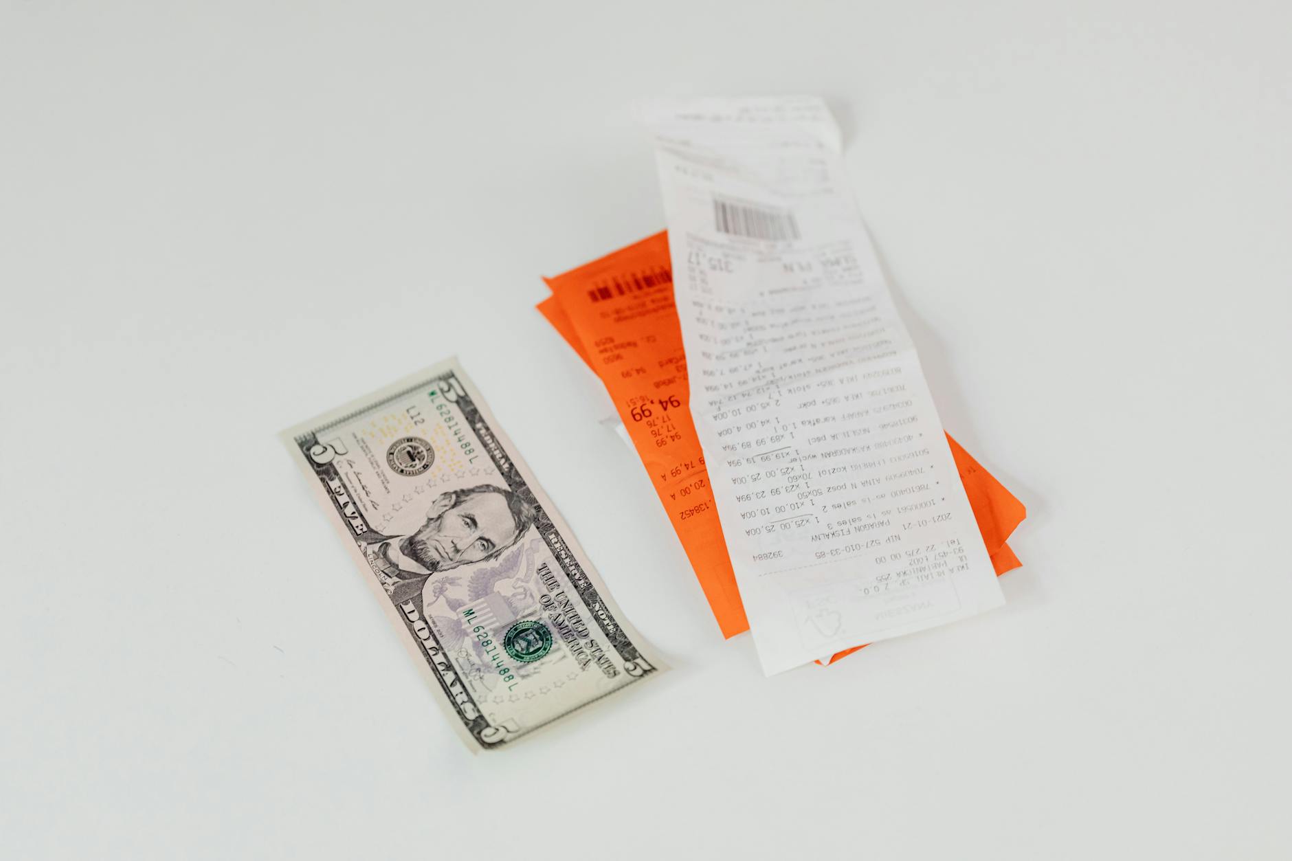 money paper and bills on white surface